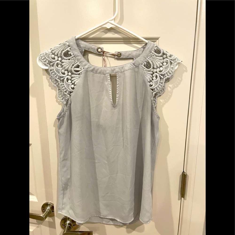 Express Shirt, Discoloration on fabric.